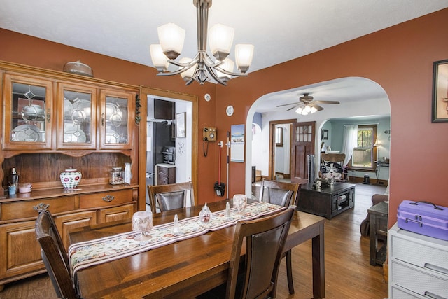 2136 Amherst Ave, Kalamazoo, MI 49008 - dining space featuring arched walkways, a chandelier, dark wood finished floors, and ceiling fan