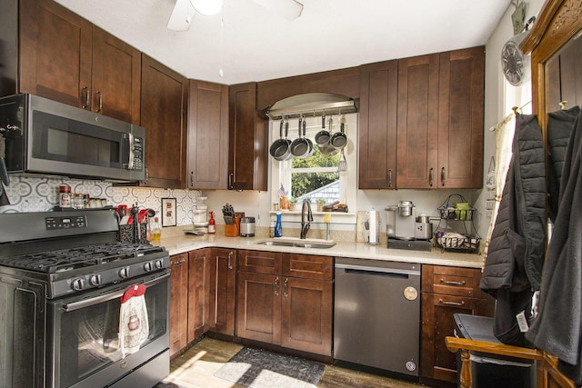 2136 Amherst Ave, Kalamazoo, MI 49008 - kitchen featuring appliances with stainless steel finishes, light countertops, ceiling fan, and wood finished floors
