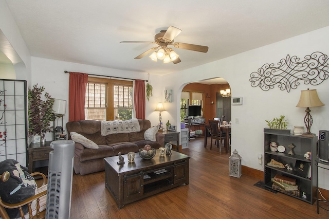 2136 Amherst Ave, Kalamazoo, MI 49008 - living room with arched walkways, wood finished floors, and a ceiling fan