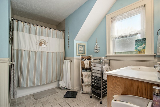 2136 Amherst Ave, Kalamazoo, MI 49008 - full bath with tile patterned floors, a wainscoted wall, vanity, and a textured ceiling
