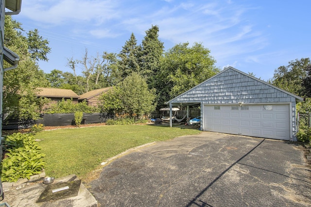 2136 Amherst Ave, Kalamazoo, MI 49008 - view of grassy yard featuring an outbuilding and a garage