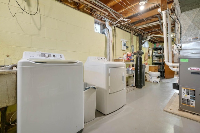 923 Par 4 Rd, Kalamazoo, MI 49008 - laundry room featuring washing machine and dryer and concrete block wall