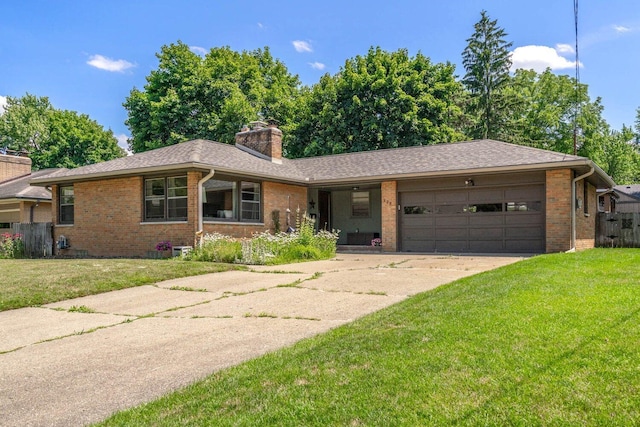 923 Par 4 Rd, Kalamazoo, MI 49008 - single story home with brick siding, driveway, a chimney, an attached garage, and a shingled roof