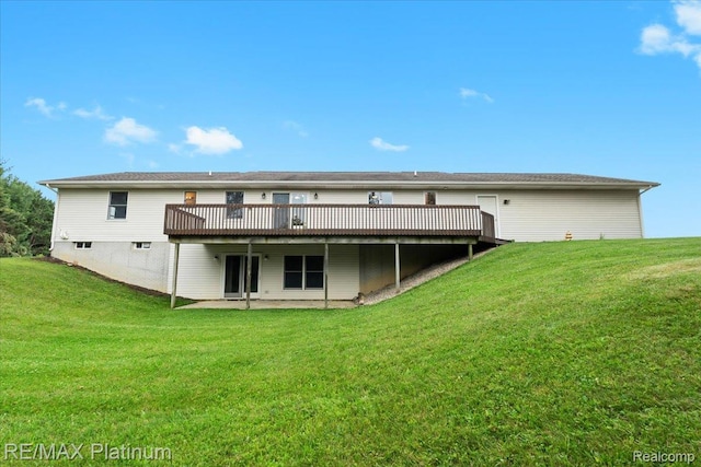 6893 Sanford Rd, Howell, MI 48855 - back of property with a deck, a yard, and a patio