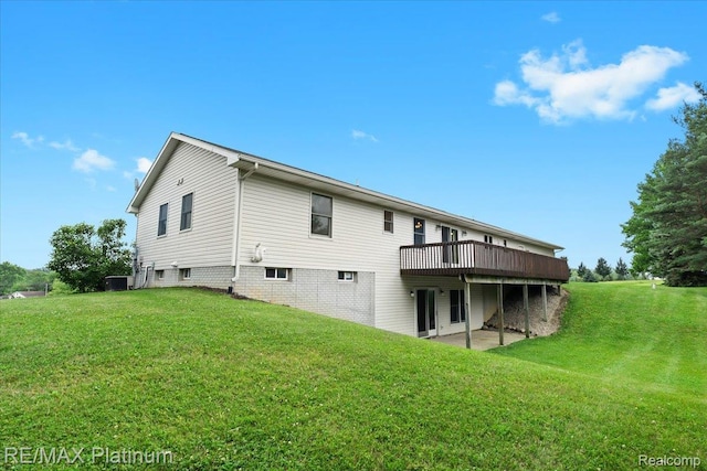 6893 Sanford Rd, Howell, MI 48855 - rear view of house with a yard and a wooden deck