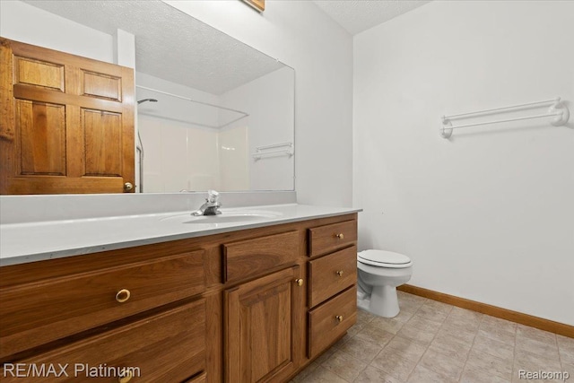 6893 Sanford Rd, Howell, MI 48855 - bathroom with vanity, a textured ceiling, and a shower