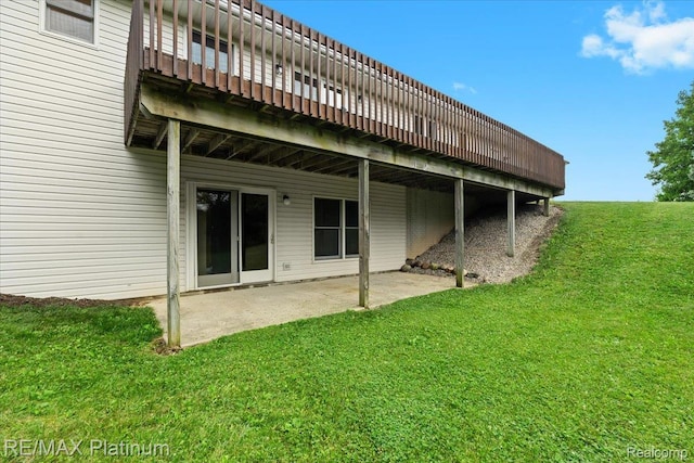6893 Sanford Rd, Howell, MI 48855 - back of house with a lawn, a patio area, and a wooden deck