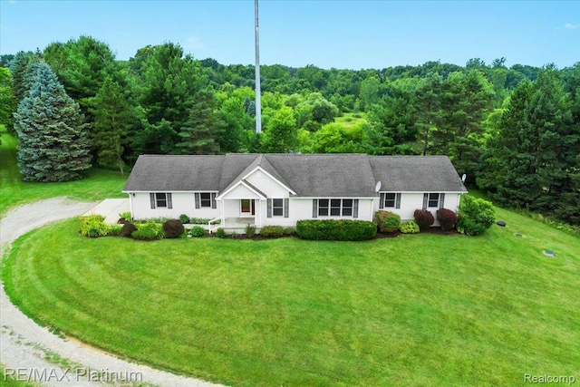 6893 Sanford Rd, Howell, MI 48855 - ranch-style house featuring driveway, a front yard, and a wooded view