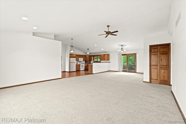 6893 Sanford Rd, Howell, MI 48855 - unfurnished living room featuring carpet, a ceiling fan, lofted ceiling, and recessed lighting