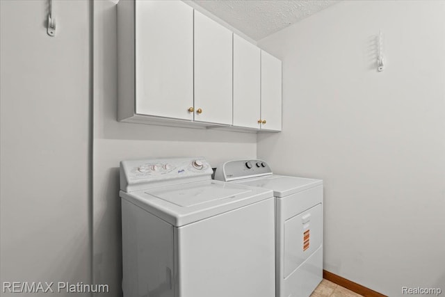 6893 Sanford Rd, Howell, MI 48855 - washroom featuring cabinet space, washer and dryer, and a textured ceiling
