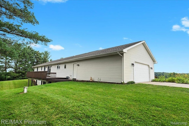 6893 Sanford Rd, Howell, MI 48855 - rear view of property featuring a garage, a lawn, concrete driveway, and a wooden deck