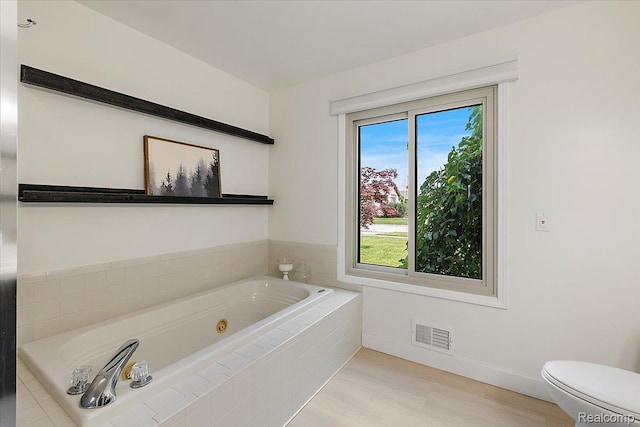 15924 Myrtle Dr, Macomb, MI 48042 - full bathroom featuring a tub with jets and wood finished floors