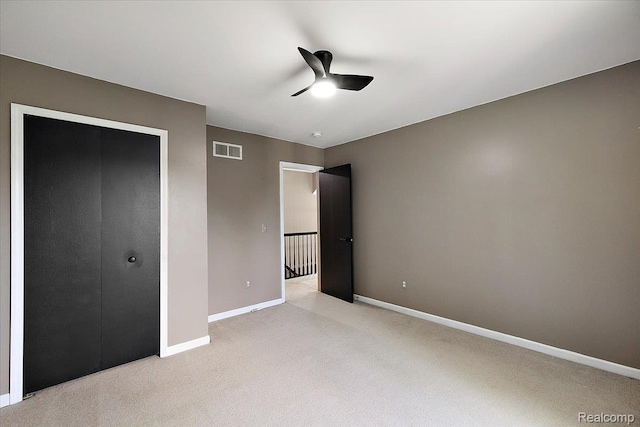 15924 Myrtle Dr, Macomb, MI 48042 - unfurnished bedroom featuring light colored carpet, ceiling fan, and a closet