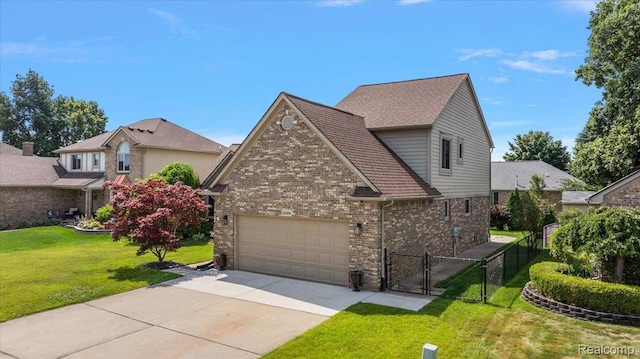 15924 Myrtle Dr, Macomb, MI 48042 - view of home's exterior featuring a gate, brick siding, concrete driveway, and an attached garage