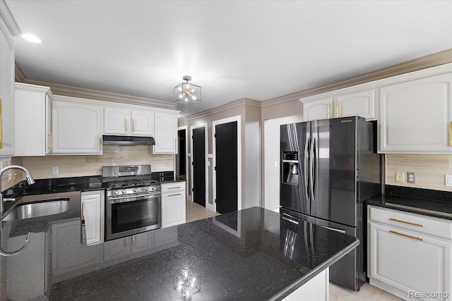 15924 Myrtle Dr, Macomb, MI 48042 - kitchen with stainless steel gas stove, black fridge, under cabinet range hood, and decorative backsplash
