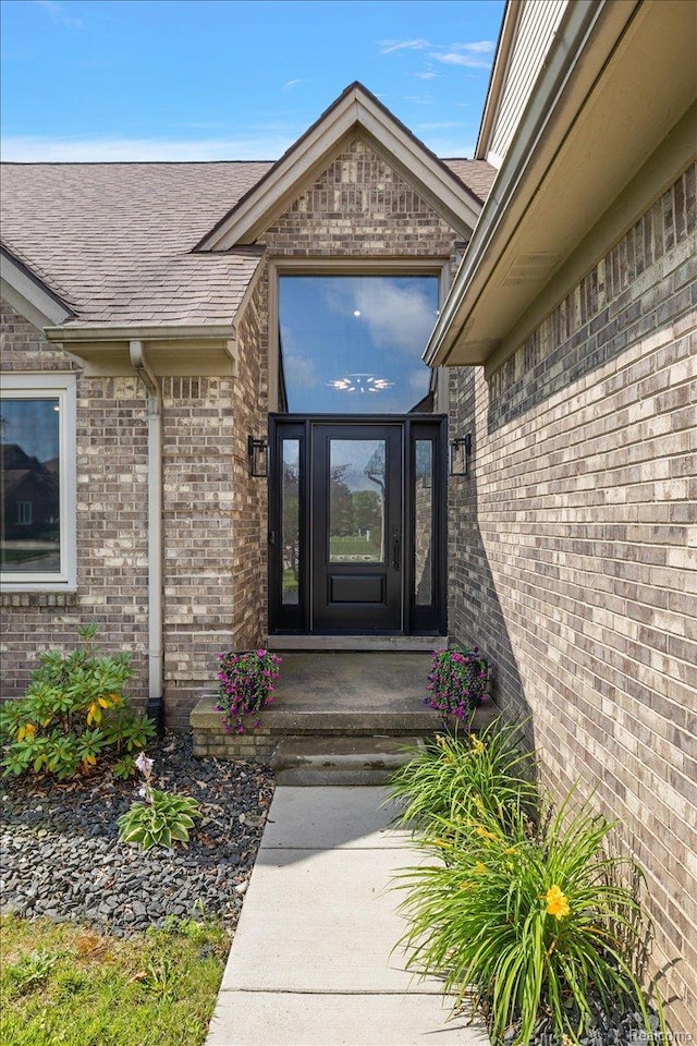 15924 Myrtle Dr, Macomb, MI 48042 - entrance to property featuring brick siding and roof with shingles
