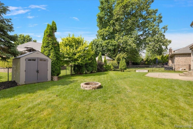 15924 Myrtle Dr, Macomb, MI 48042 - fenced backyard with a fire pit, a storage shed, and a patio