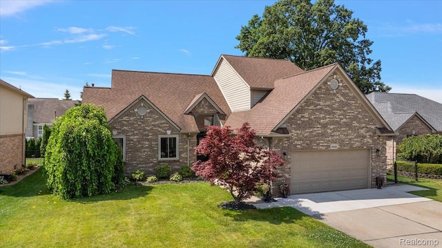 15924 Myrtle Dr, Macomb, MI 48042 - view of front of property featuring concrete driveway, a front lawn, brick siding, and an attached garage