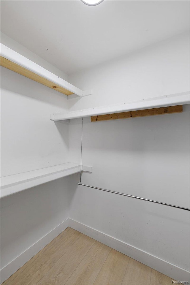 15924 Myrtle Dr, Macomb, MI 48042 - spacious closet featuring light wood-type flooring