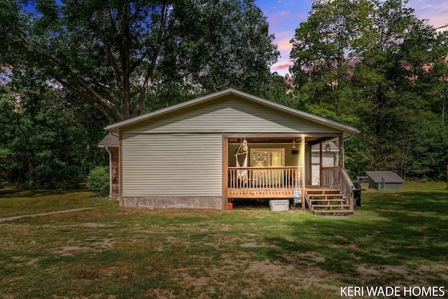3231 E Baker Rd, Hesperia, MI 49421 - view of front of property featuring a lawn and a porch