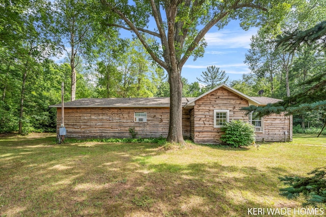 3231 E Baker Rd, Hesperia, MI 49421 - view of side of home featuring a lawn