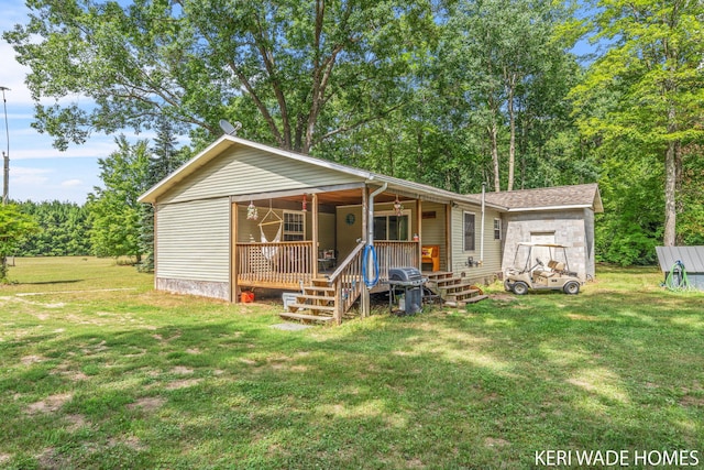 3231 E Baker Rd, Hesperia, MI 49421 - view of front of property featuring a front lawn and covered porch