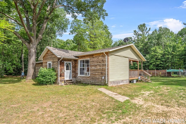 3231 E Baker Rd, Hesperia, MI 49421 - view of front of house featuring stone siding, entry steps, and roof with shingles