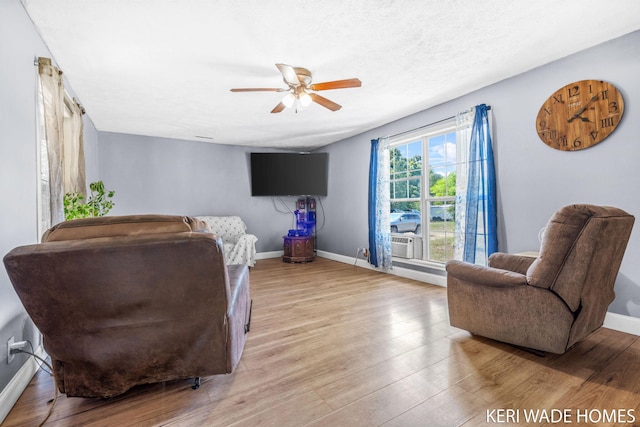 3231 E Baker Rd, Hesperia, MI 49421 - living area featuring a ceiling fan and wood finished floors