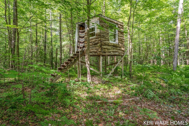 3231 E Baker Rd, Hesperia, MI 49421 - view of outdoor structure with a wooded view and stairs