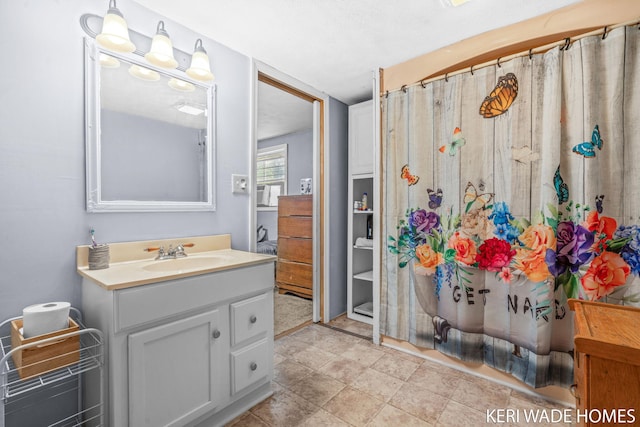 3231 E Baker Rd, Hesperia, MI 49421 - bathroom with vanity and a shower with curtain
