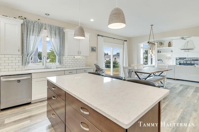 6129 W Bay Ct, Hudsonville, MI 49426 - kitchen featuring stainless steel dishwasher, light wood-type flooring, decorative backsplash, and recessed lighting