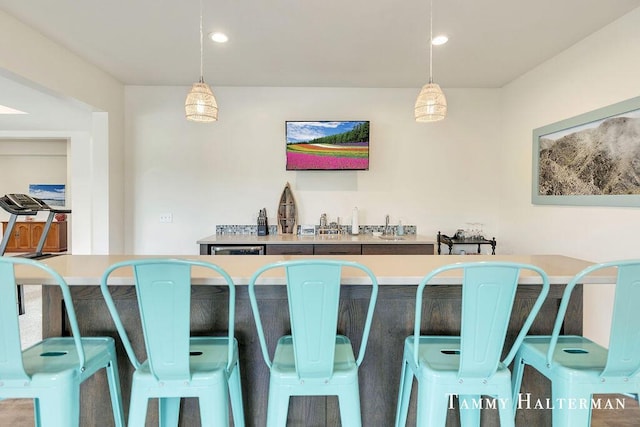 6129 W Bay Ct, Hudsonville, MI 49426 - bar area with hanging light fixtures and recessed lighting