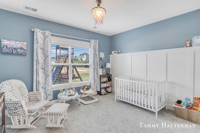 6129 W Bay Ct, Hudsonville, MI 49426 - carpeted bedroom with a crib