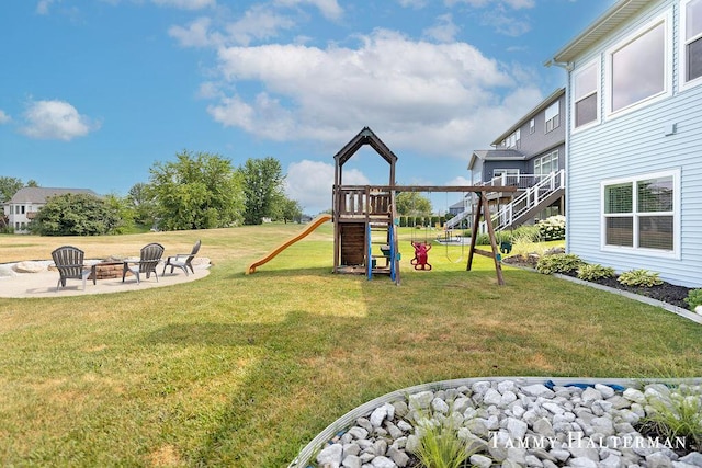 6129 W Bay Ct, Hudsonville, MI 49426 - view of grassy yard with a fire pit and a playground