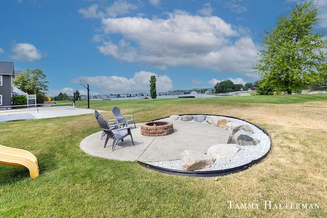 6129 W Bay Ct, Hudsonville, MI 49426 - view of grassy yard featuring an outdoor fire pit and a patio area