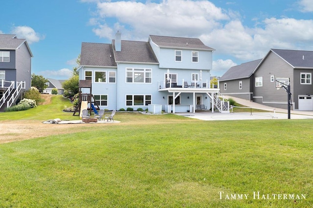 6129 W Bay Ct, Hudsonville, MI 49426 - rear view of property featuring a patio area, a fire pit, a chimney, stairs, and a yard
