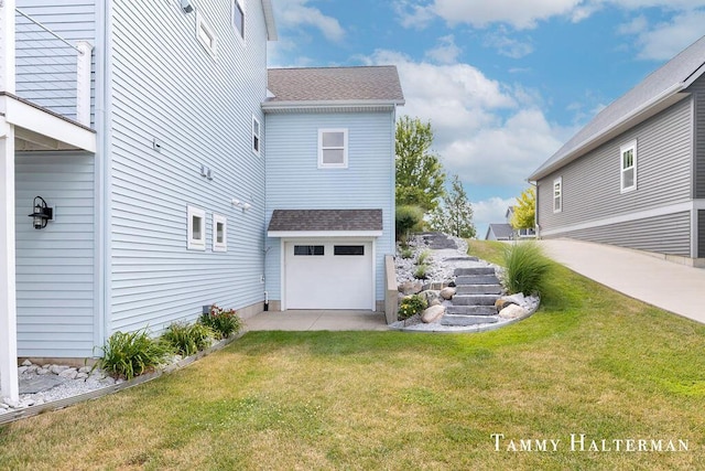 6129 W Bay Ct, Hudsonville, MI 49426 - view of home's exterior with a shingled roof, a yard, and a garage