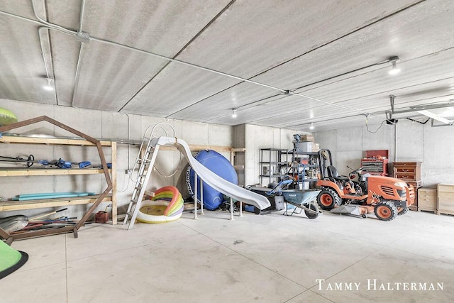 6129 W Bay Ct, Hudsonville, MI 49426 - garage featuring a garage door opener