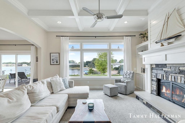 6129 W Bay Ct, Hudsonville, MI 49426 - living area featuring arched walkways, coffered ceiling, healthy amount of natural light, ceiling fan, and beamed ceiling