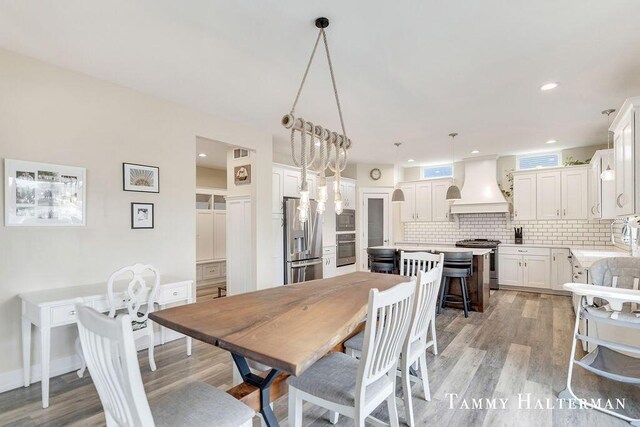 6129 W Bay Ct, Hudsonville, MI 49426 - dining space with light wood-style flooring and recessed lighting