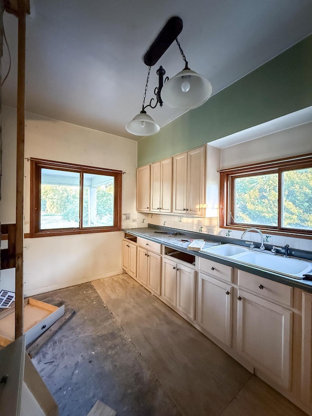 10677 Mason Dr, Grant, MI 49327 - kitchen featuring plenty of natural light, decorative light fixtures, and tasteful backsplash