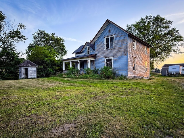 10677 Mason Dr, Grant, MI 49327 - view of front of house with a shed and a front yard