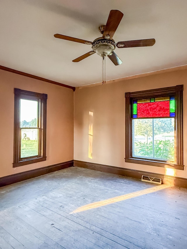 10677 Mason Dr, Grant, MI 49327 - spare room with ornamental molding, ceiling fan, and hardwood / wood-style flooring