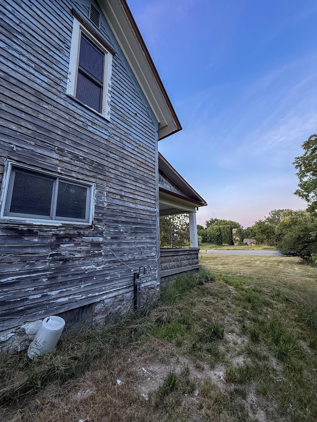 10677 Mason Dr, Grant, MI 49327 - view of home's exterior featuring a yard
