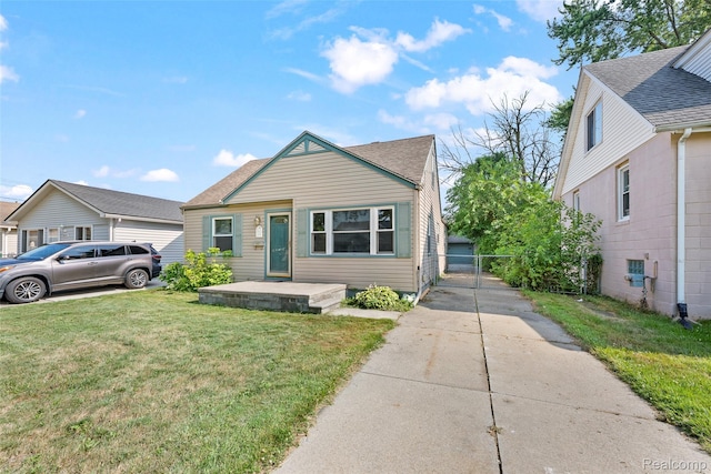 8460 Busko Ave, Utica, MI 48093 - bungalow featuring a front yard and roof with shingles