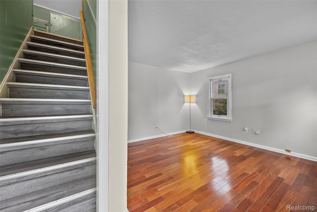 8460 Busko Ave, Utica, MI 48093 - staircase featuring baseboards and wood finished floors