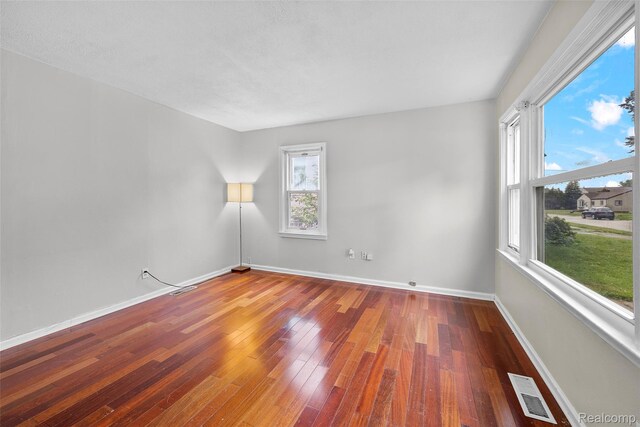 8460 Busko Ave, Utica, MI 48093 - unfurnished room with hardwood / wood-style floors and baseboards