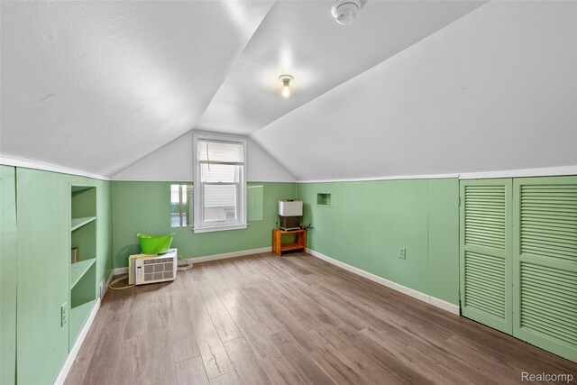 8460 Busko Ave, Utica, MI 48093 - additional living space with wood finished floors, built in shelves, and lofted ceiling