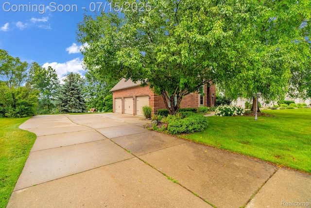 11656 Kings Colony, Grand Blanc, MI 48439 - view of property hidden behind natural elements with brick siding, a front lawn, concrete driveway, and a garage