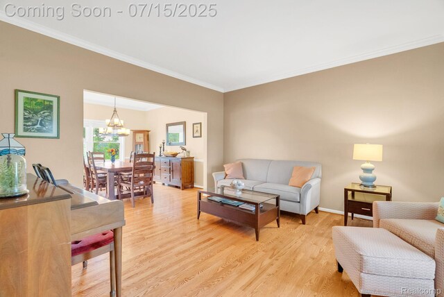 11656 Kings Colony, Grand Blanc, MI 48439 - living area featuring a chandelier, crown molding, and light wood-type flooring